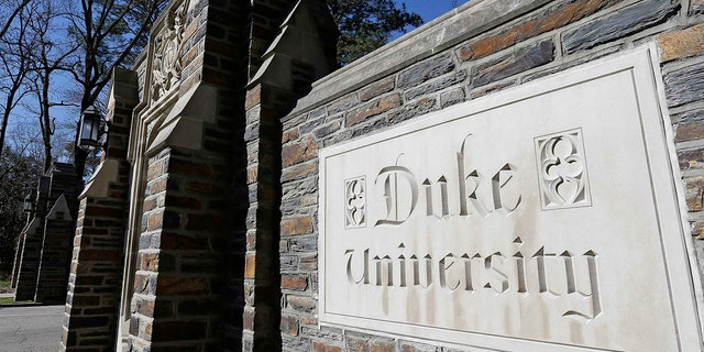 FILE - This Jan. 28, 2019 file photo shows the entrance to the main Duke University campus in Durham, N.C. Duke University announced Wednesday, March 10, 2021,  that it is considering ending in-person classes as an uptick in COVID-19 cases over the course of five days worsens and students continue to violate health guidelines. (AP Photo/Gerry Broome, File)